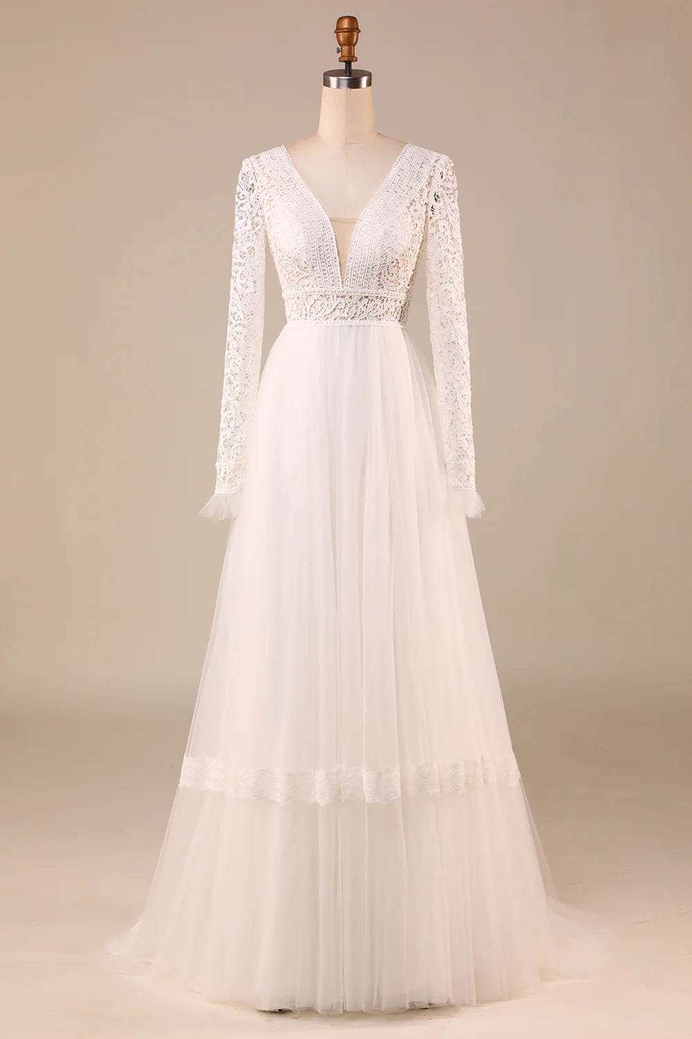 Elegant A-Line wedding dress with long lace sleeves on a model.