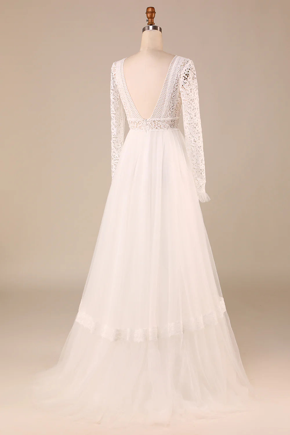 Side view of an A-Line lace wedding gown with long sleeves.