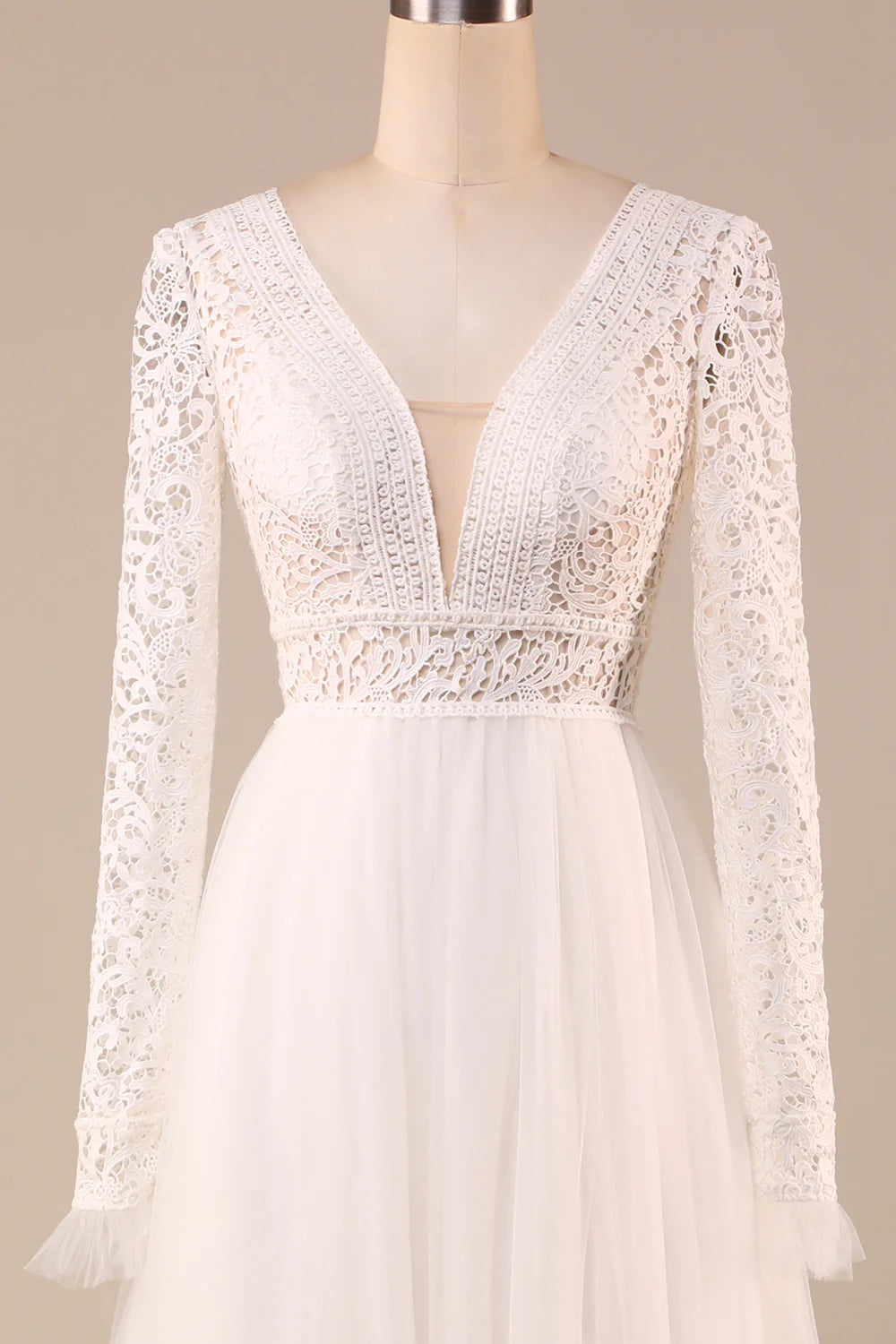 Back view of an ivory A-Line wedding dress with lace details.