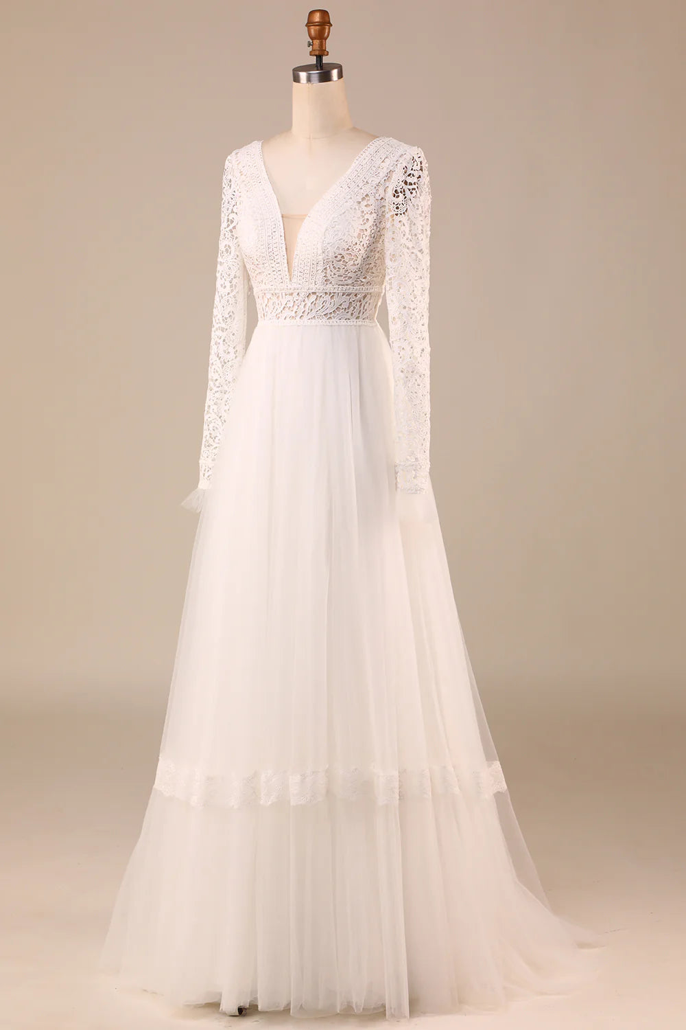 Front view of an A-Line bridal gown featuring intricate lace and long sleeves.