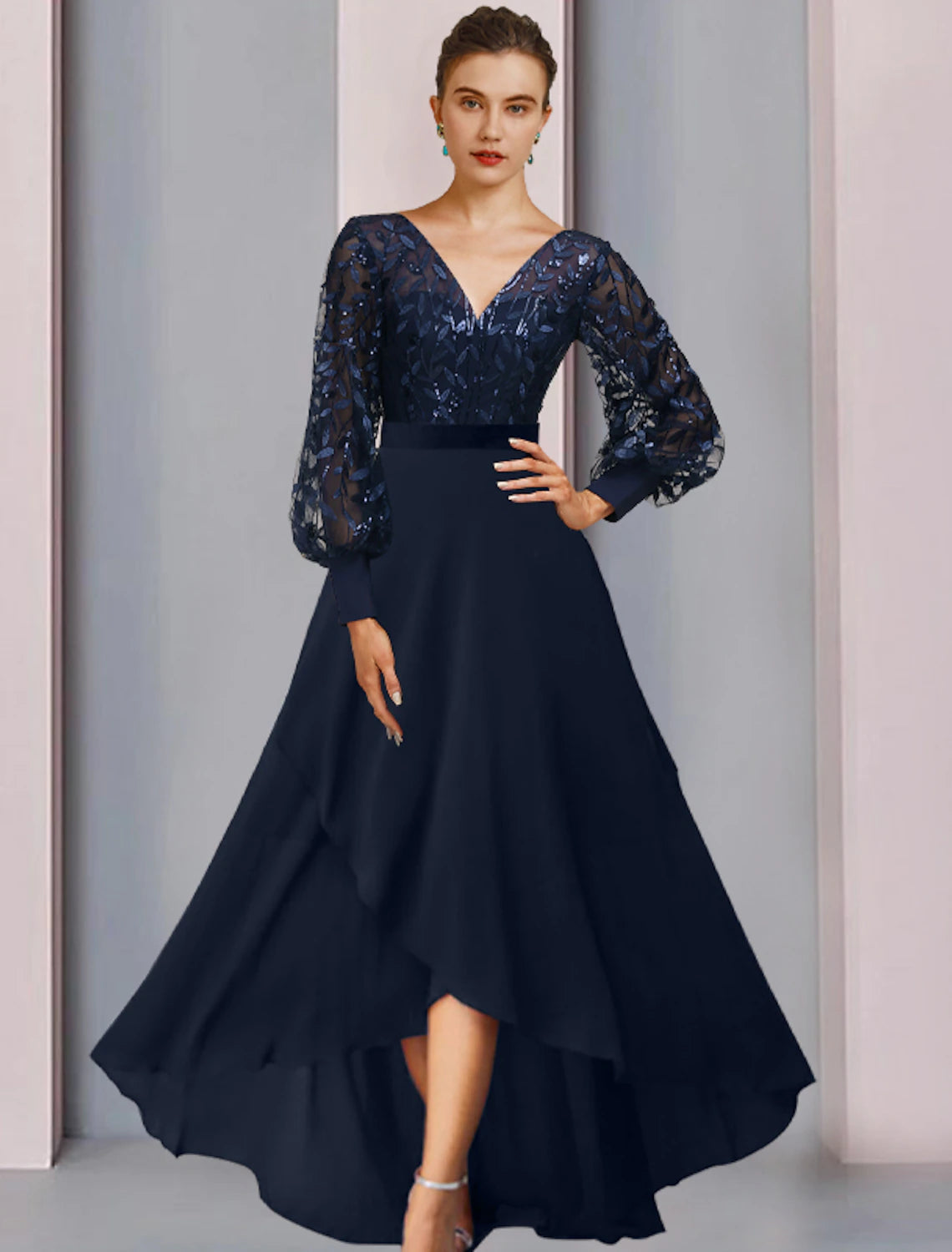 Woman wearing an elegant A-line jewel neck long sleeve sequin lace high-low dress.