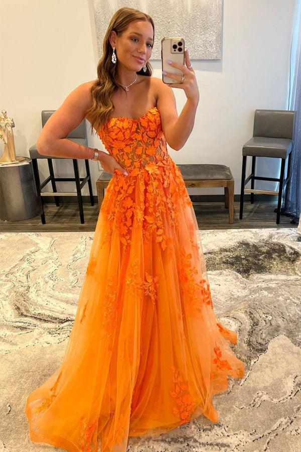 Elegant long formal prom dress made of tulle and lace, featuring a low-cut neckline.