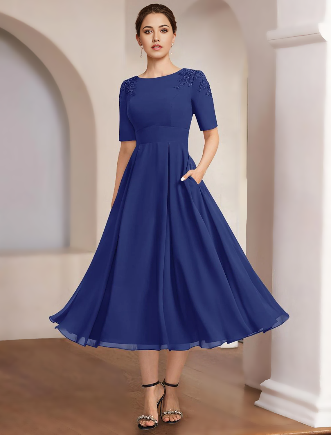 Elegant A-Line Mother of the Bride dress with bateau neck and half sleeves.
