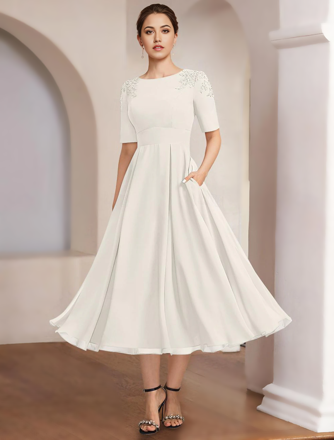 Back view of an A-Line Mother of the Bride dress, featuring tea length and lace details.