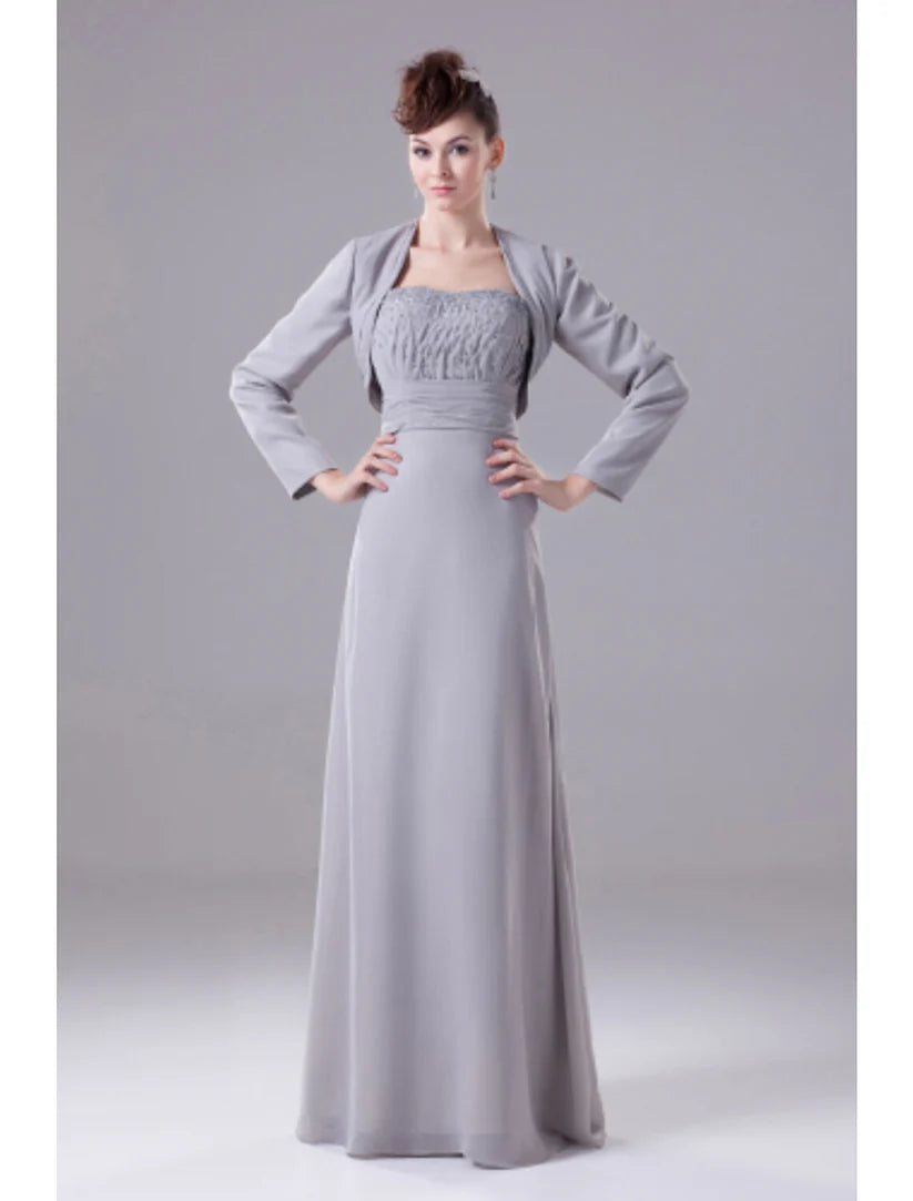 Woman wearing an elegant A-line strapless chiffon Mother of the Bride dress with intricate beading and draping.