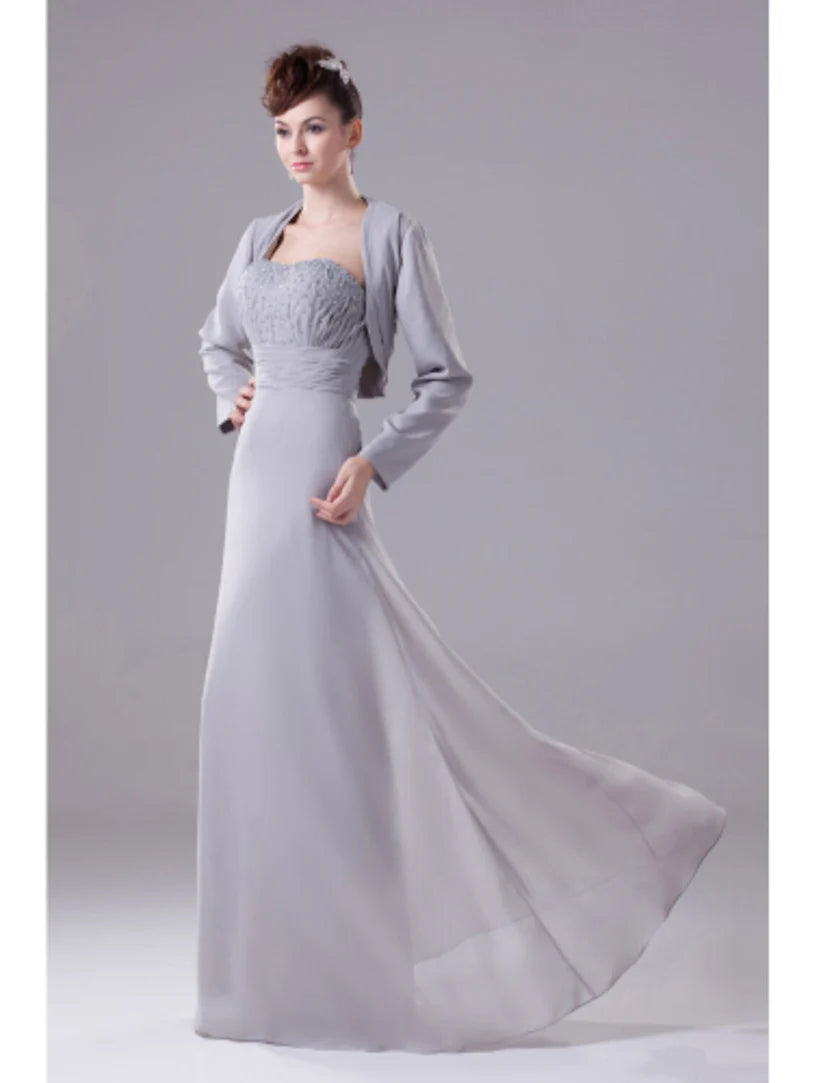 Side view of the strapless A-line chiffon dress, highlighting the beading and flowing fabric.