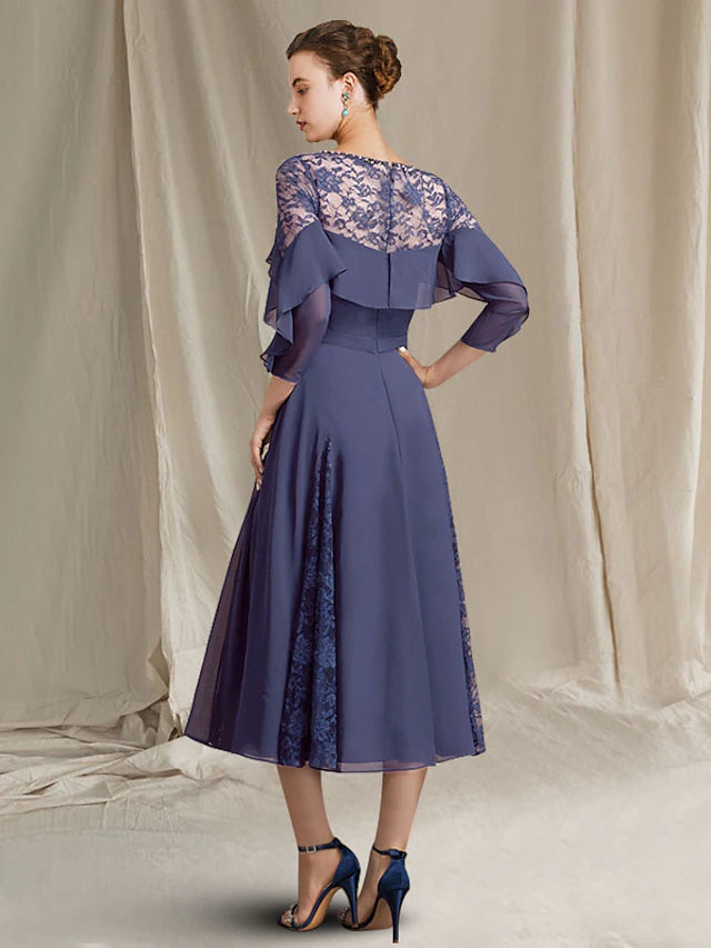 Close-up of the tea length chiffon dress featuring pleats and sequin ruffles.