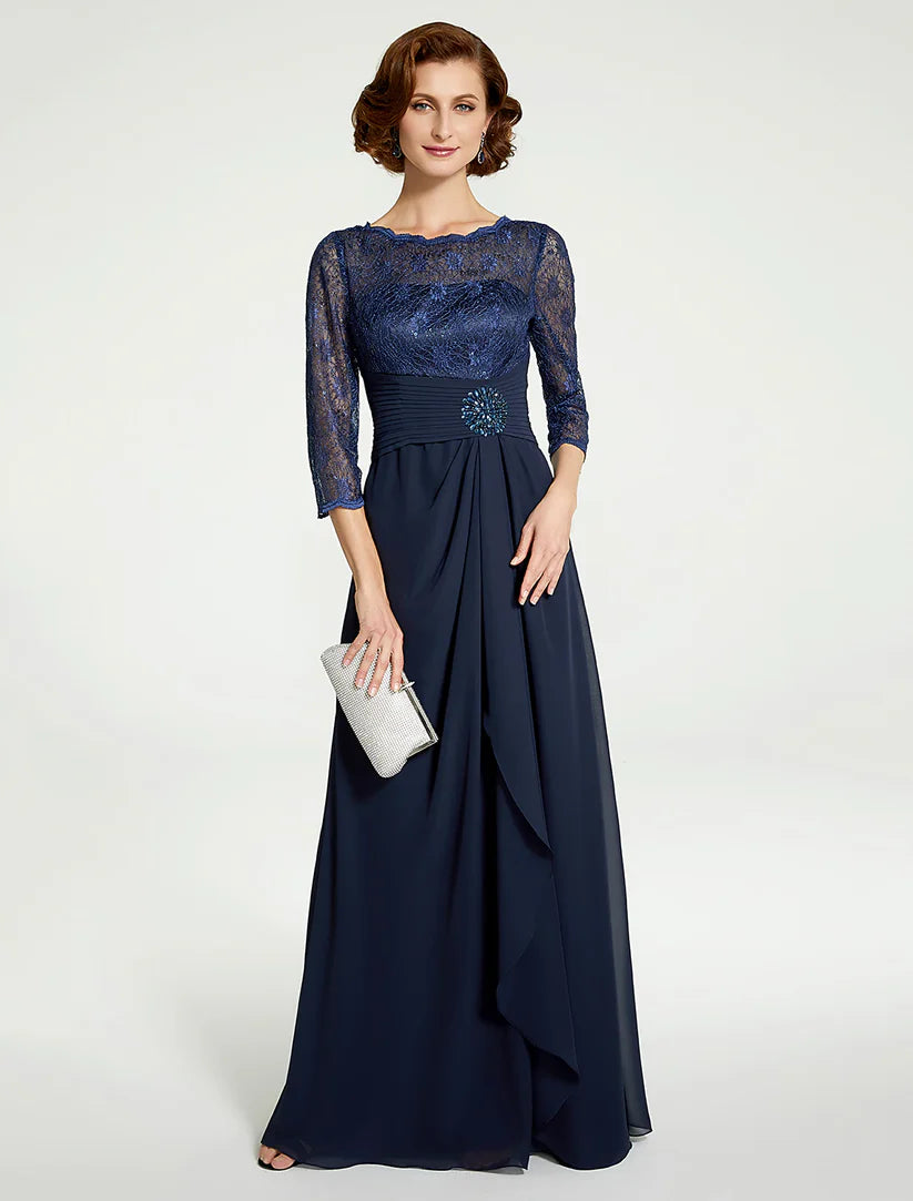 Woman wearing an elegant A-line mother of the bride dress with jewel neck, 3/4 sleeves, and lace ruching.