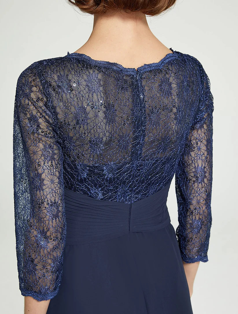 Full view of a woman in a floor-length chiffon lace dress, perfect for a wedding.