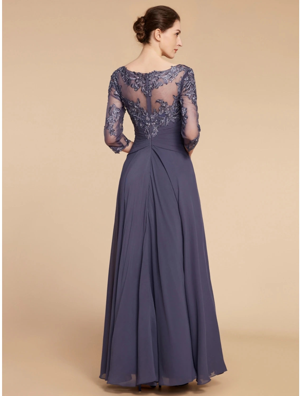 Back view of the floor-length chiffon and lace dress with subtle ruching.