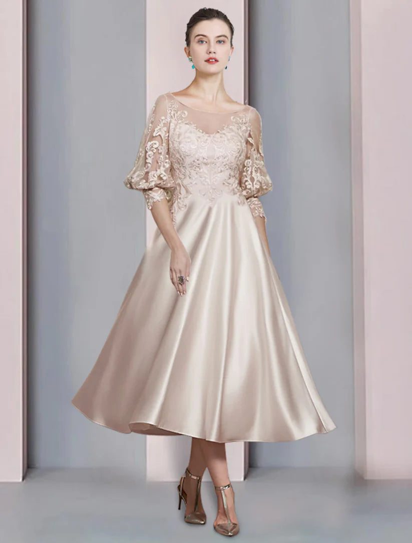 Elegant A-Line Mother of the Bride dress with scoop neck, 3/4 sleeves, and lace appliques.