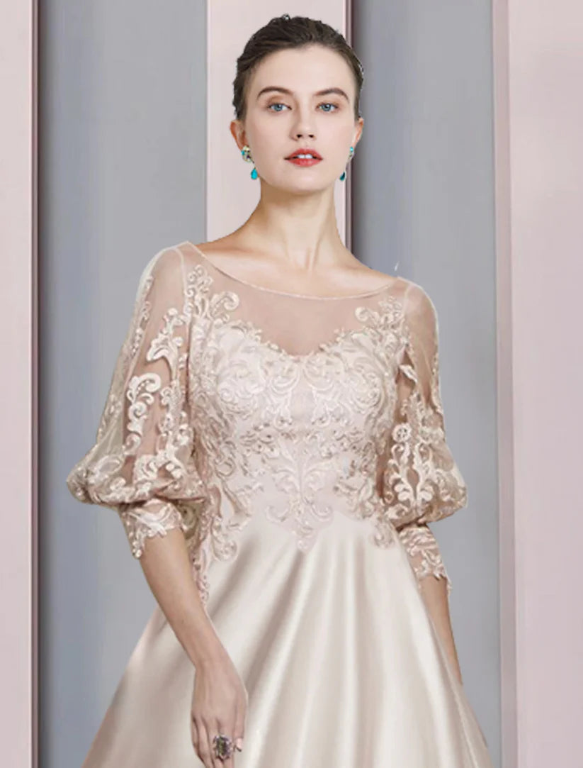 Back view of A-Line tea length satin dress with delicate lace details.