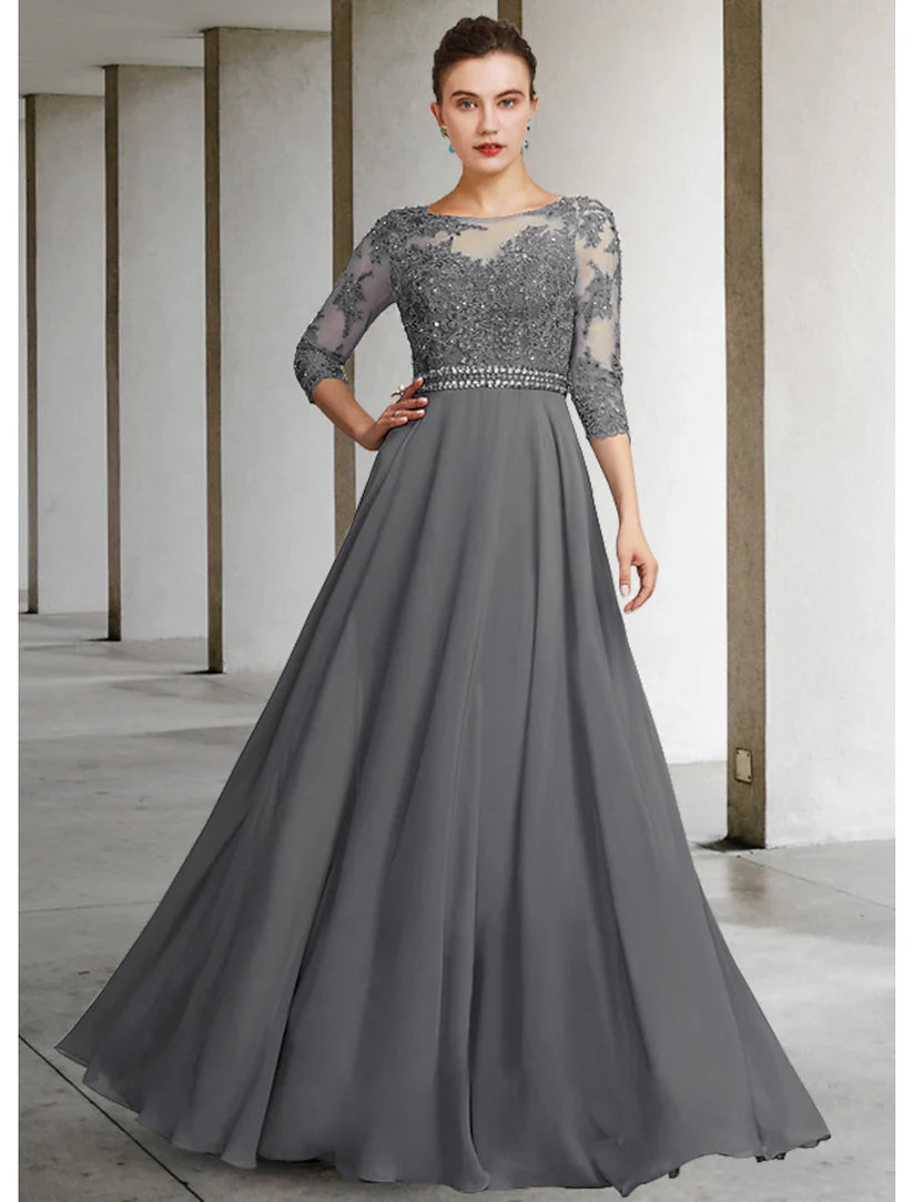 Side view of elegant floor-length lace and chiffon gown.