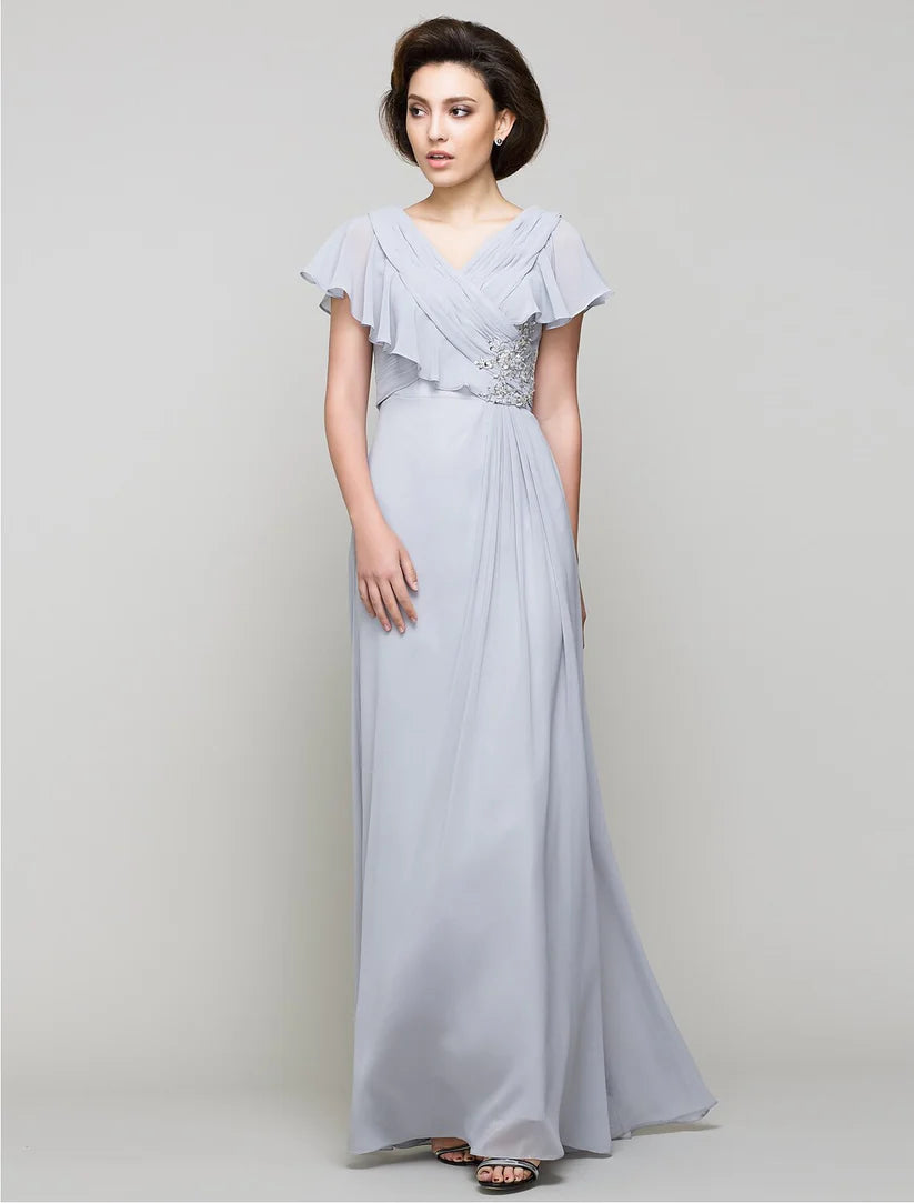 Elegant A-line Mother of the Bride dress with V-neck, chiffon fabric, and criss-cross crystal details.