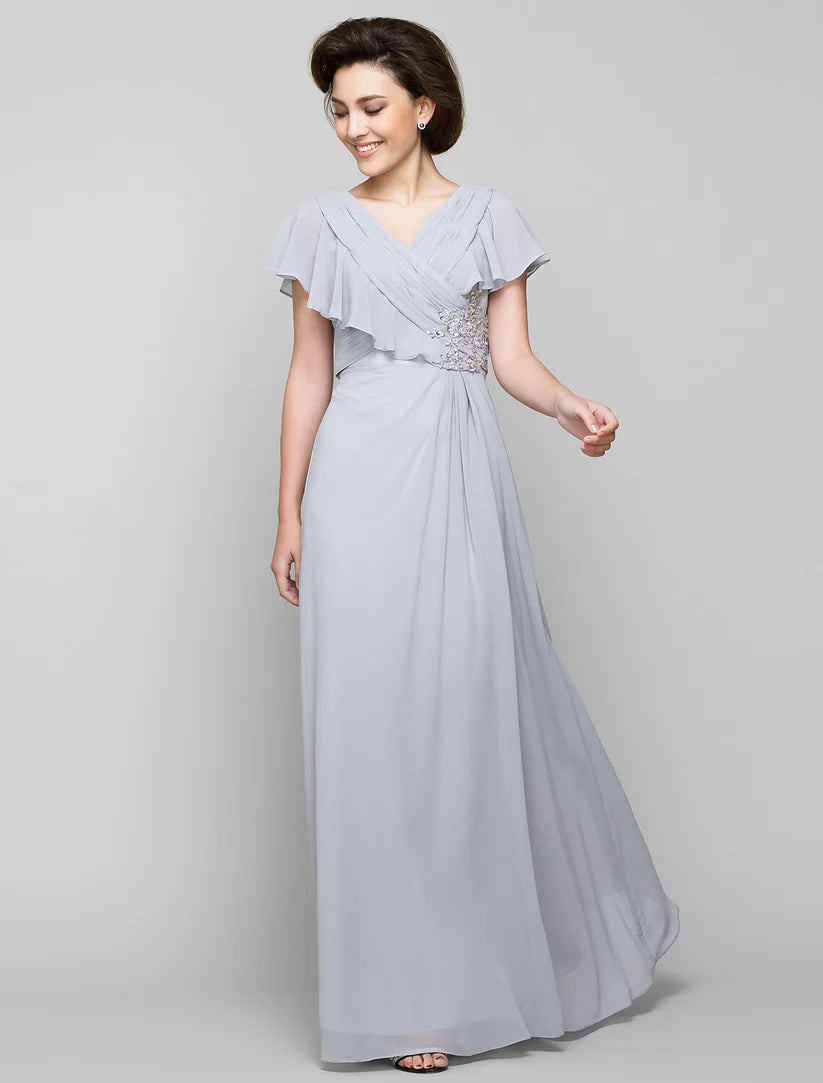 Elegant A-line Mother of the Bride dress with V-neck, chiffon fabric, and criss-cross crystal details.