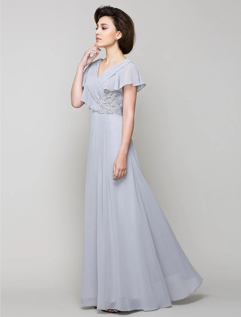 Elegant A-line Mother of the Bride dress with V-neck, chiffon fabric, and criss-cross crystal details.