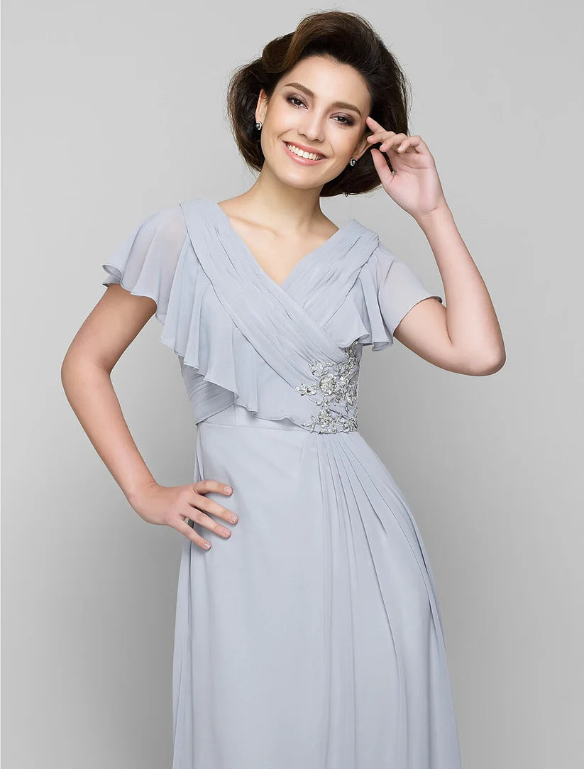 Elegant A-line Mother of the Bride dress with V-neck, chiffon fabric, and criss-cross crystal details.