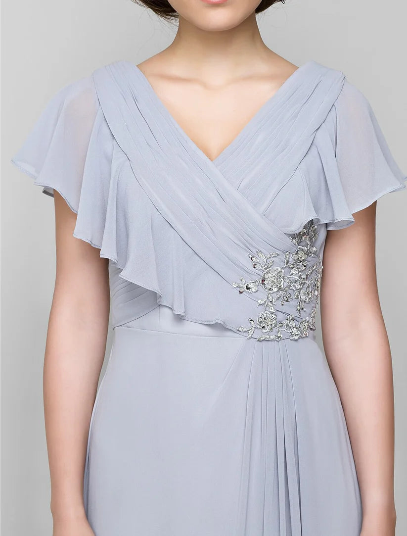 Elegant A-line Mother of the Bride dress with V-neck, chiffon fabric, and criss-cross crystal details.