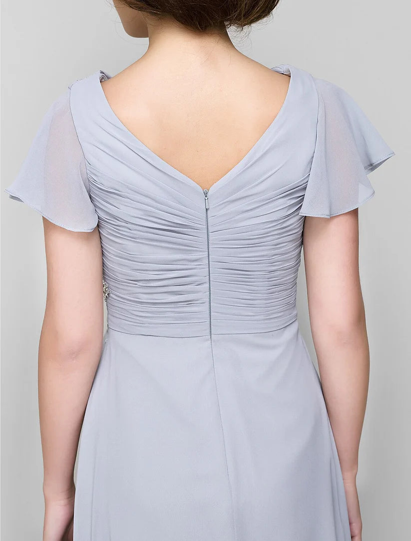 Elegant A-line Mother of the Bride dress with V-neck, chiffon fabric, and criss-cross crystal details.