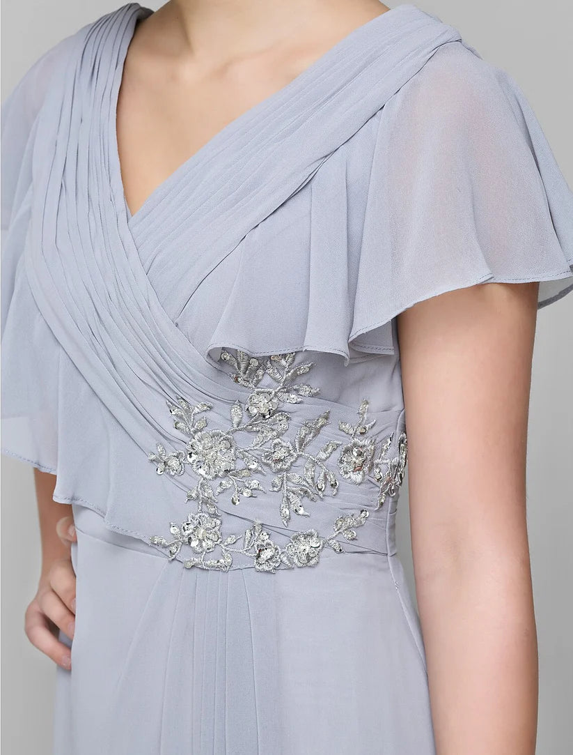 Elegant A-line Mother of the Bride dress with V-neck, chiffon fabric, and criss-cross crystal details.