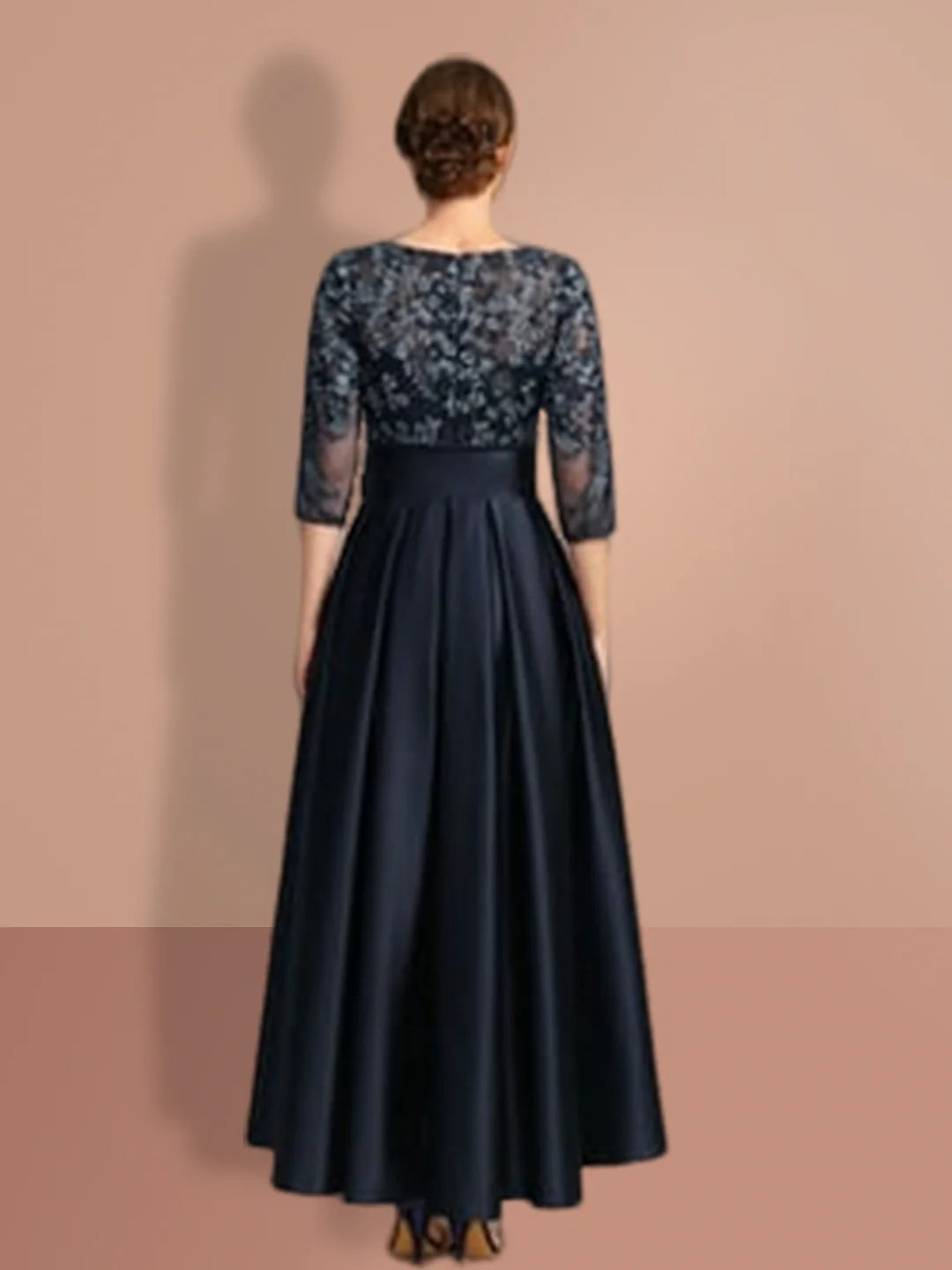 Back view of an A-line formal dress with 3/4 sleeves, suitable for a wedding.