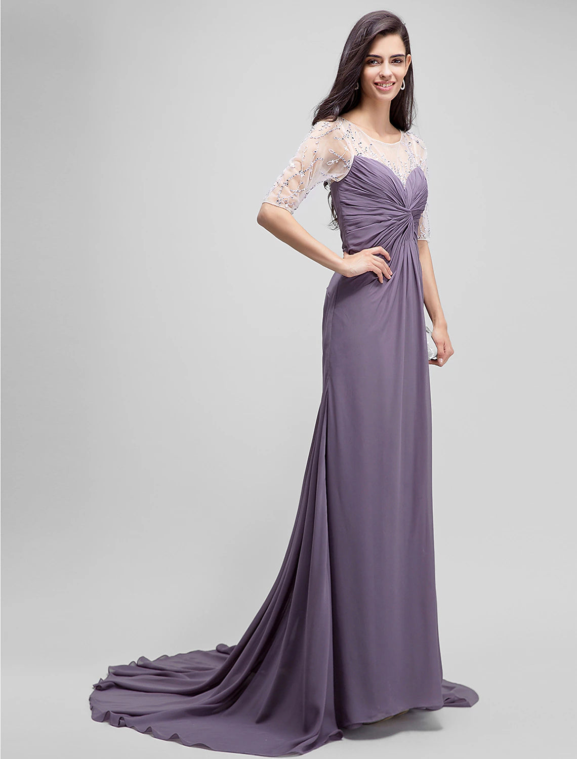 Side profile of the floor-length mother of the bride gown.