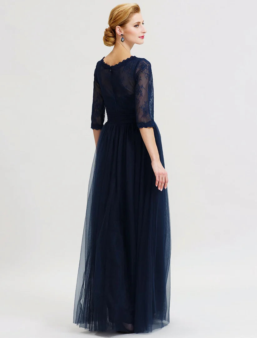 Back view of A-Line Mother of the Bride dress showing sheer lace and pleats.