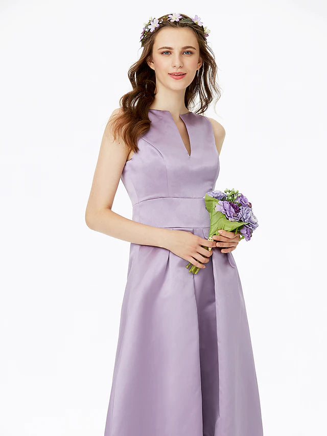 Side view of a satin A-line dress showing pleats and flow.