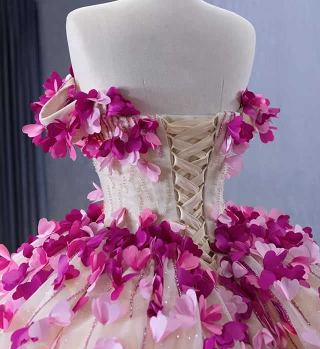 Full view of the flowing A-line skirt and back detail of the champagne tulle prom dress.