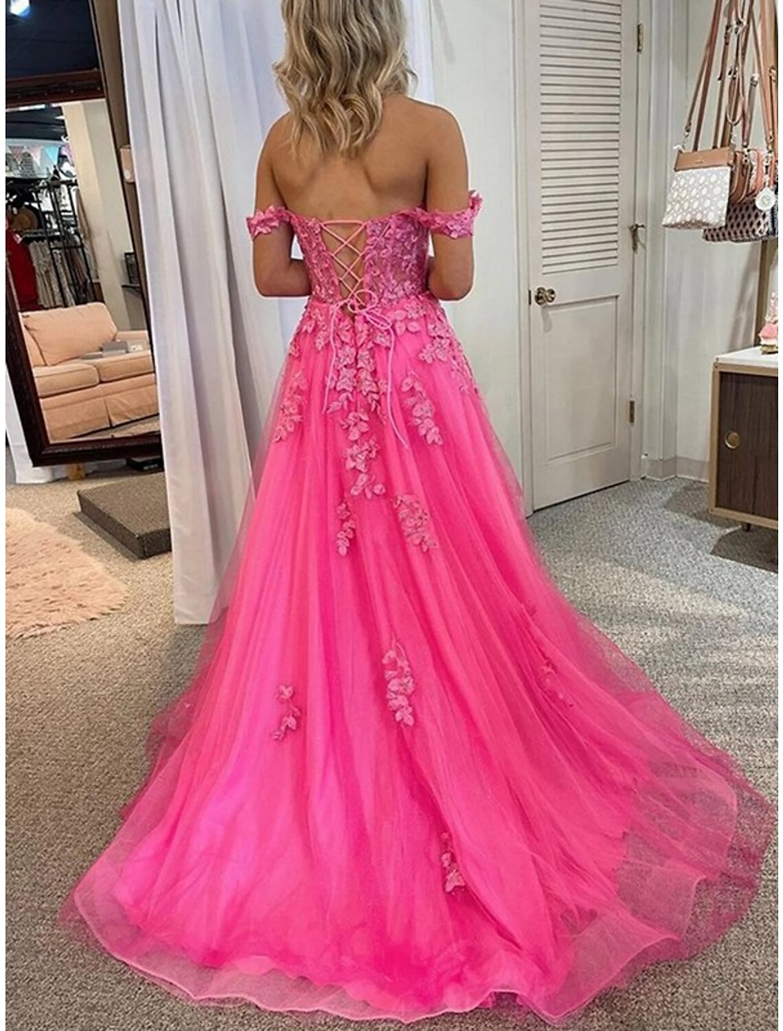 Back view of the A-Line off-shoulder prom dress, showing backless detail.