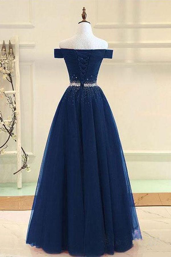 Back view of an A-line off-shoulder beaded tulle prom dress.