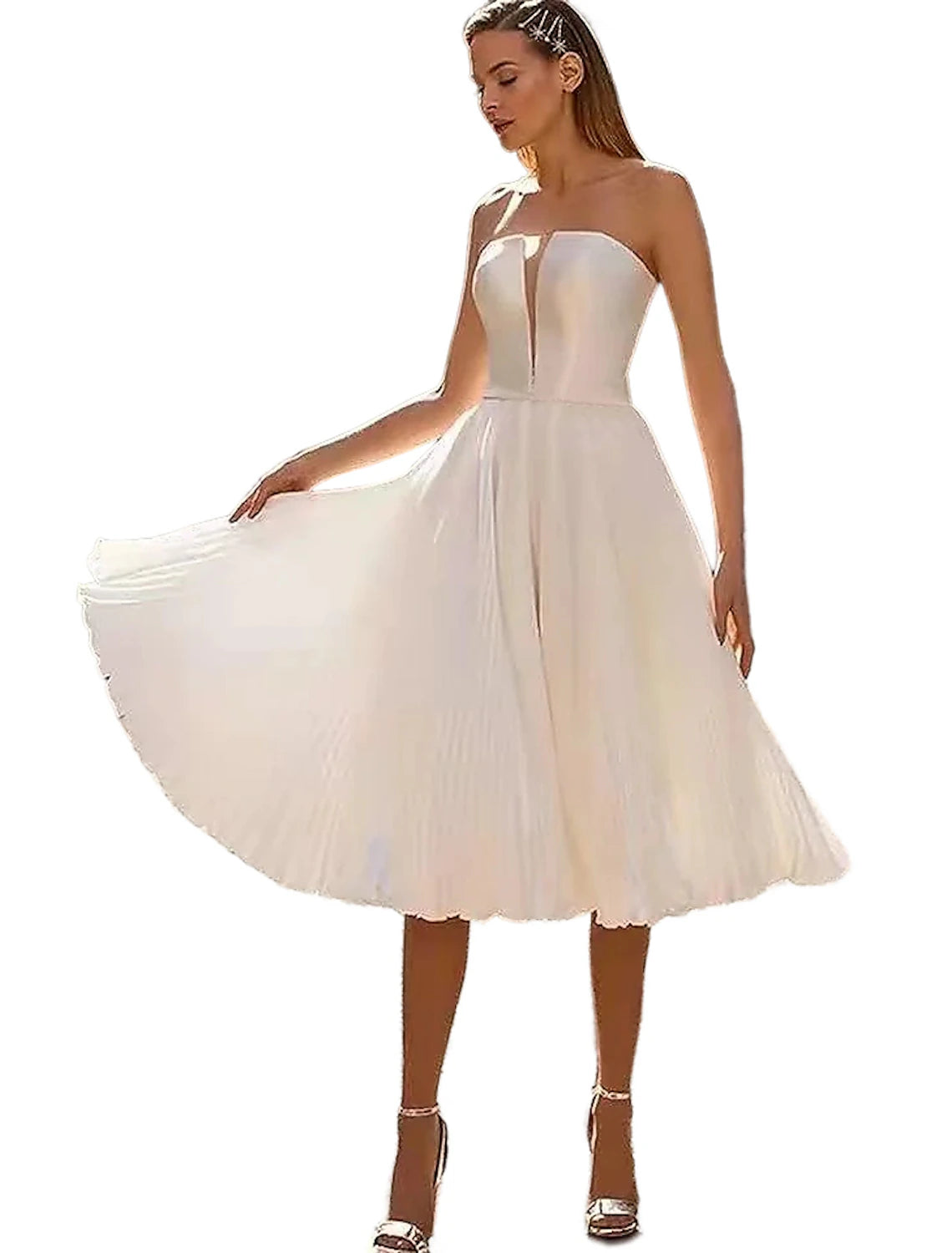 Back view of a knee-length tulle bridal gown with cap sleeves.