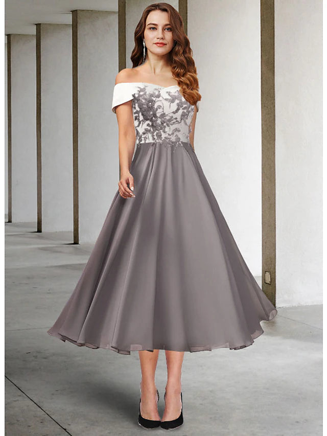 Elegant A-Line Mother of the Bride dress with off-shoulder neckline and short sleeves.