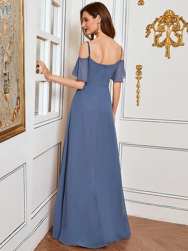 Side view of the sleeveless chiffon dress with draping.