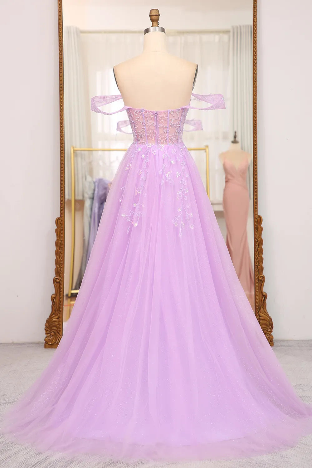 Close-up of the intricate beading and corset detail on the prom dress.