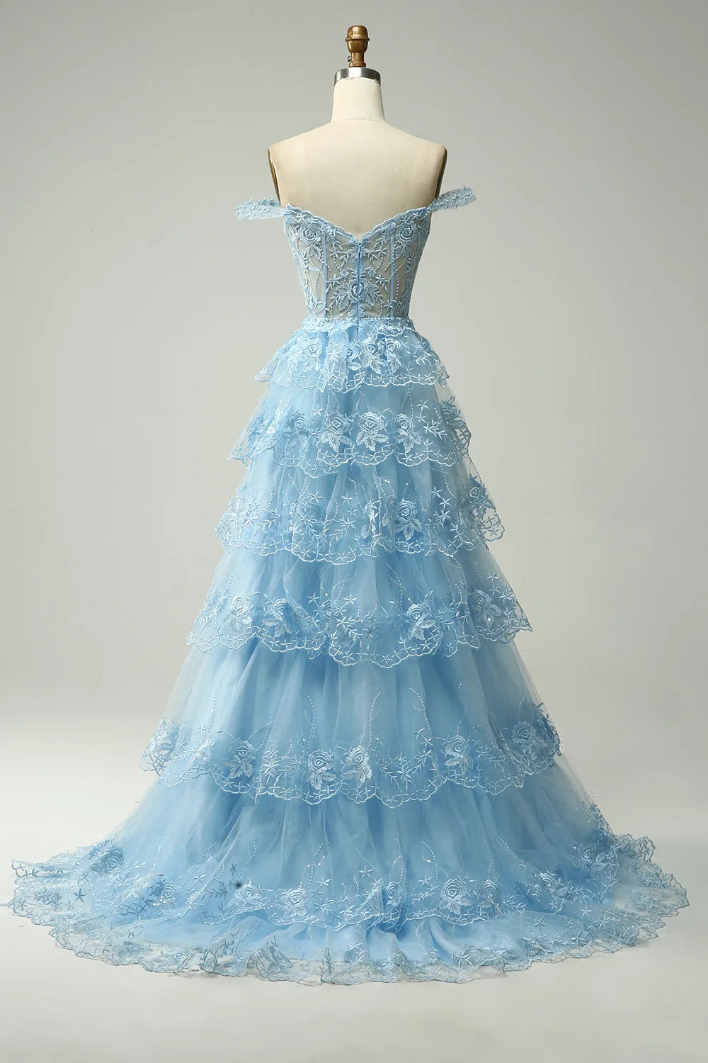 Detail of the lace ruffles and fabric texture on the prom dress.