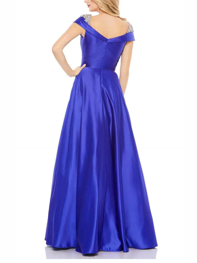 Elegant A-line off-shoulder floor-length evening dress on a model.
