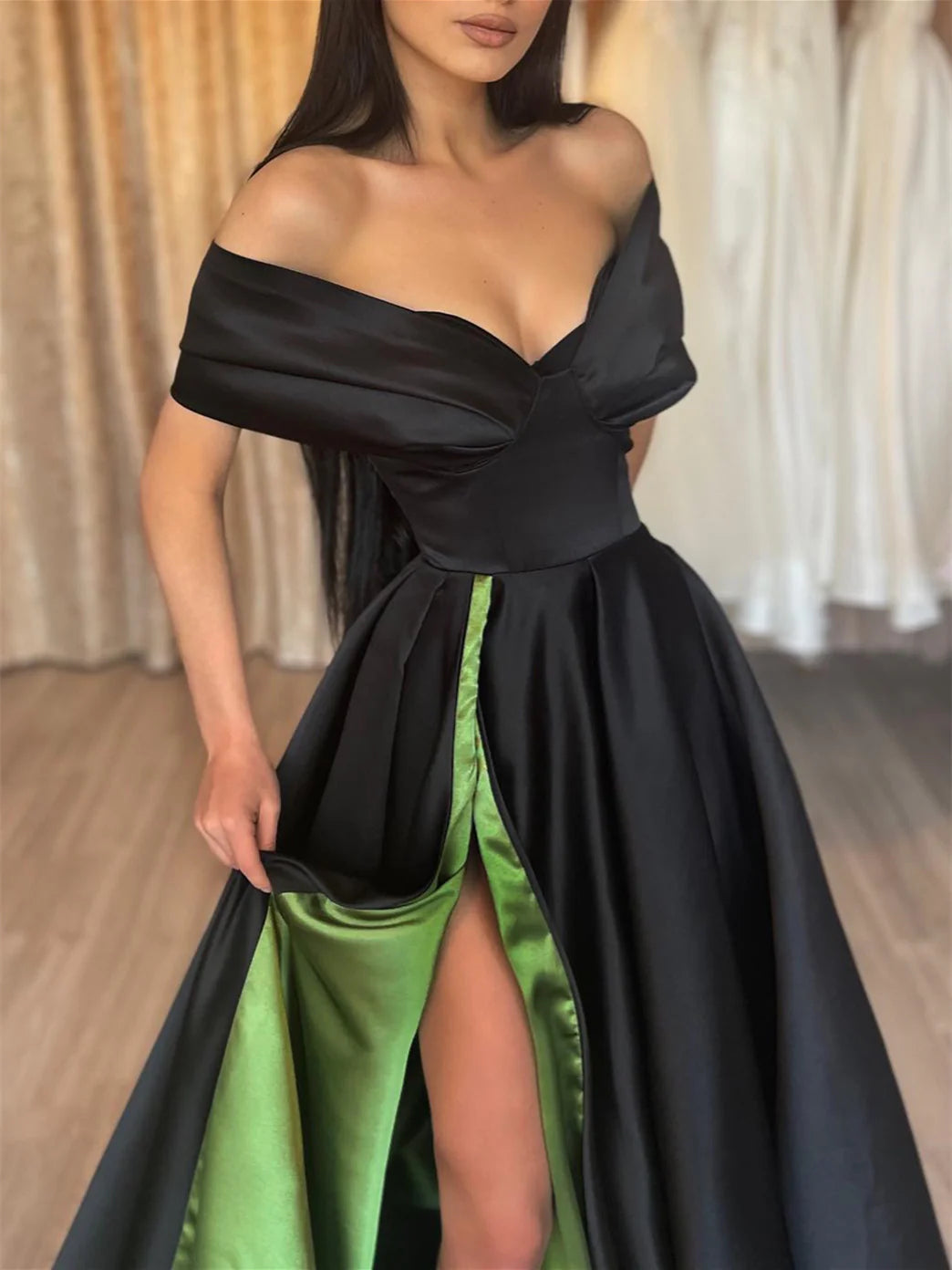 A-Line off-shoulder floor length prom dress, side view.