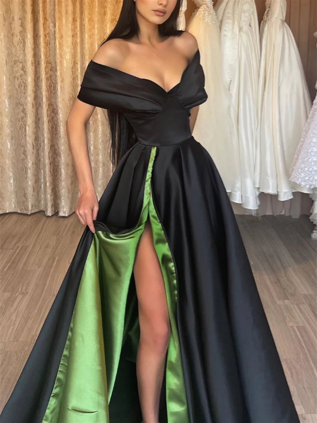 A-Line off-shoulder floor length prom dress, back view.