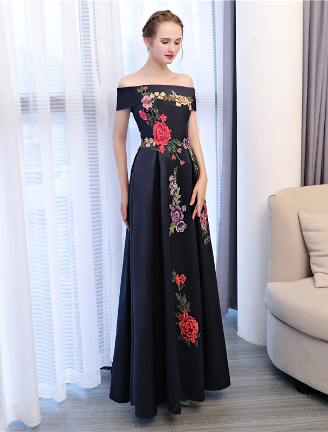 Back view of the A-line floor-length wedding guest dress.