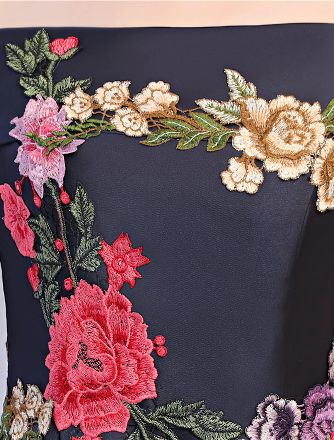 Full view of the A-line floral embroidered evening gown.