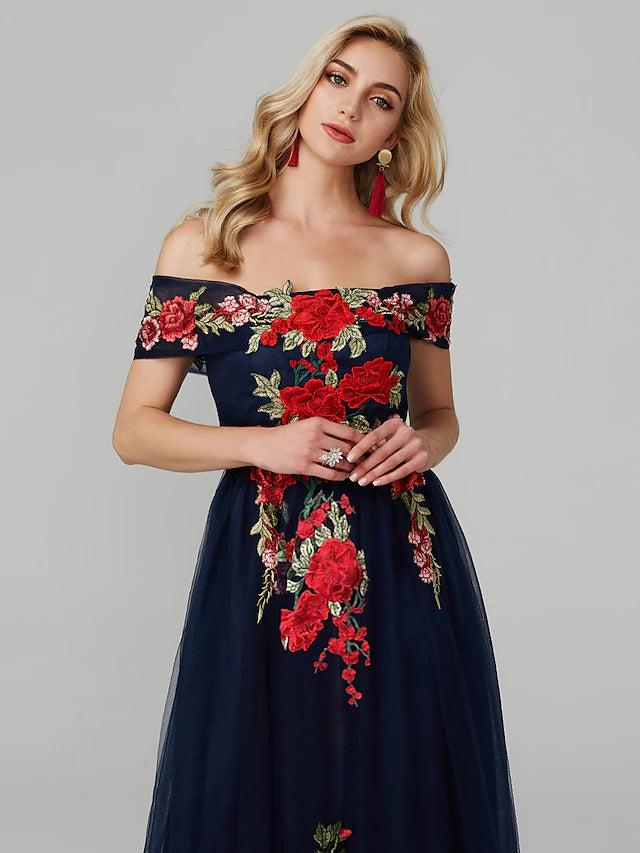 Side view of the A-line off-shoulder dress, showcasing its flowing floor-length silhouette.