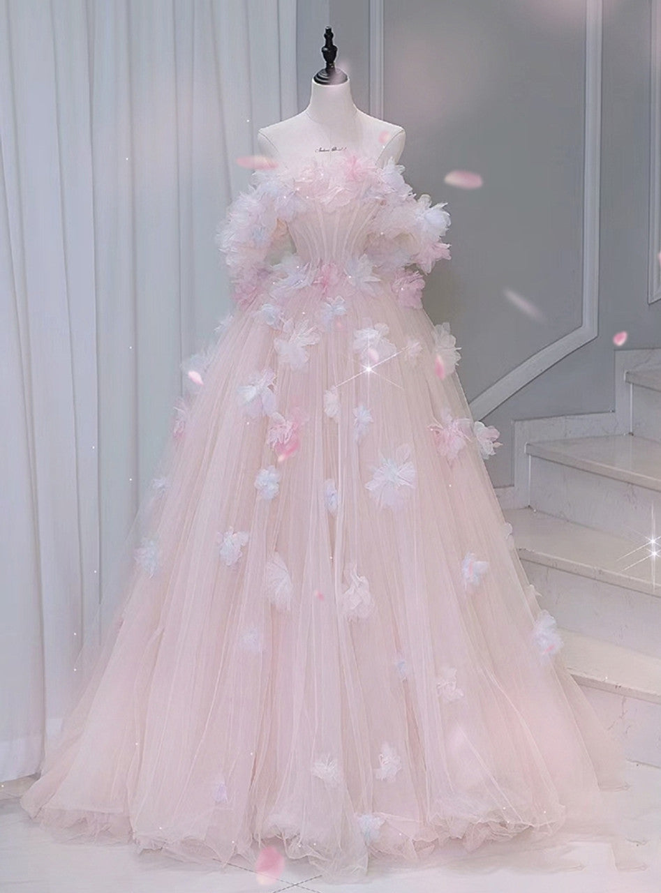Elegant off-shoulder A-line prom dress with floral appliques and flowing tulle skirt.