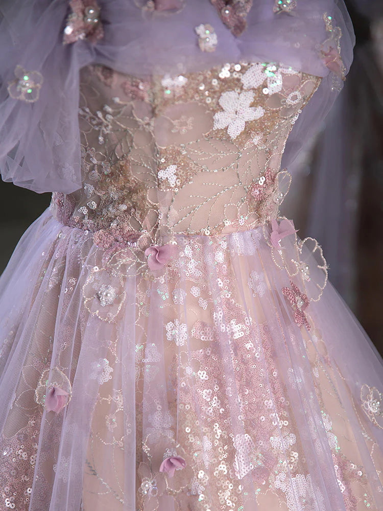 Back view of a model wearing a graceful off-shoulder long formal gown.