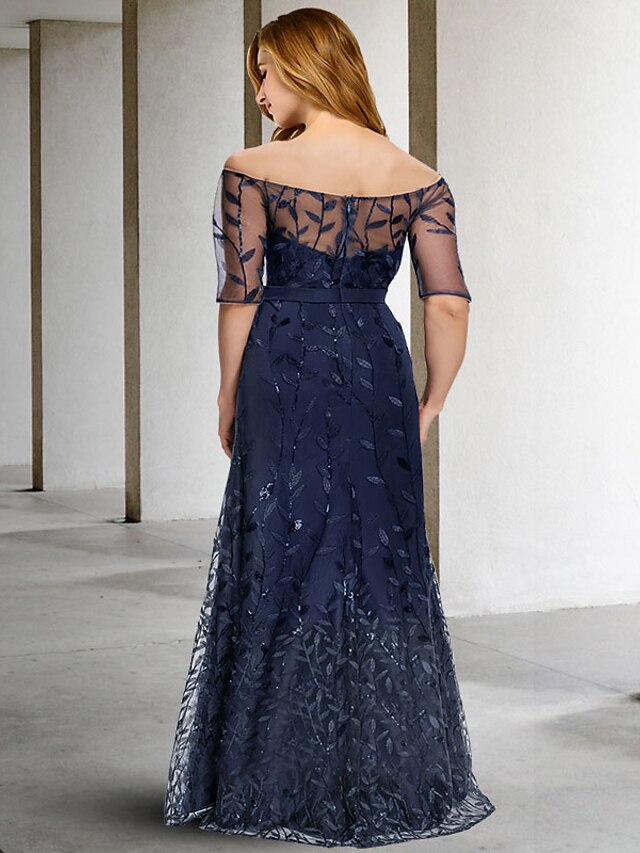 Close-up of the sequin embroidery and tulle fabric on the half-sleeve of a plus size mother of the bride dress.