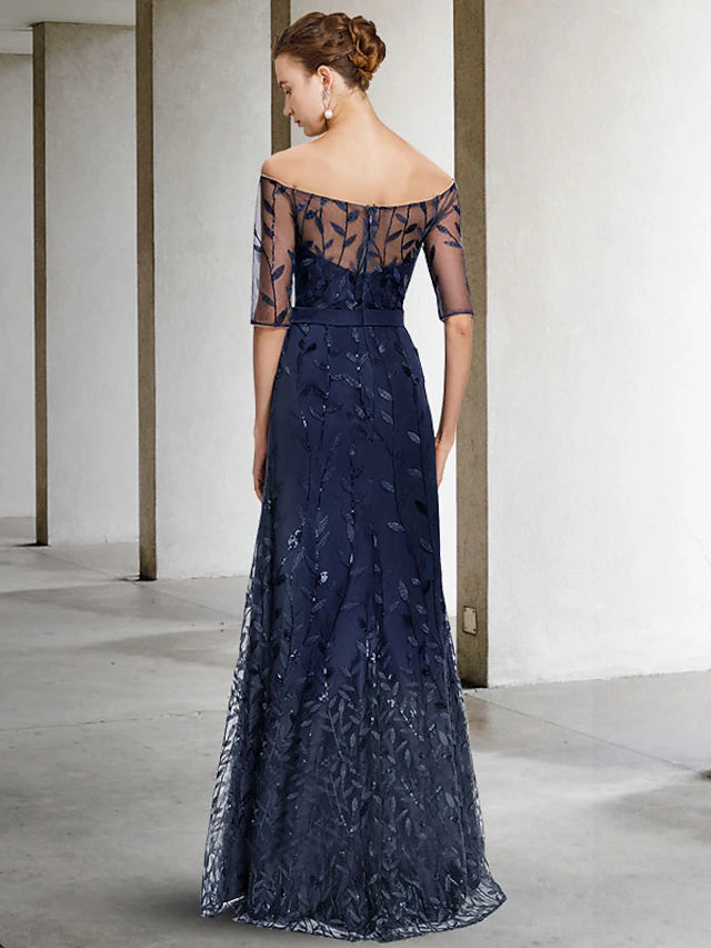 Close-up of sparkling sequin appliques and delicate lace on the dress.