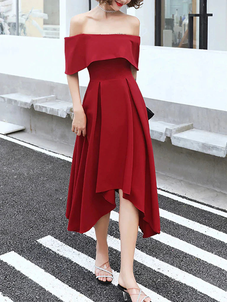 Woman wearing a chic off-shoulder high-low prom dress.