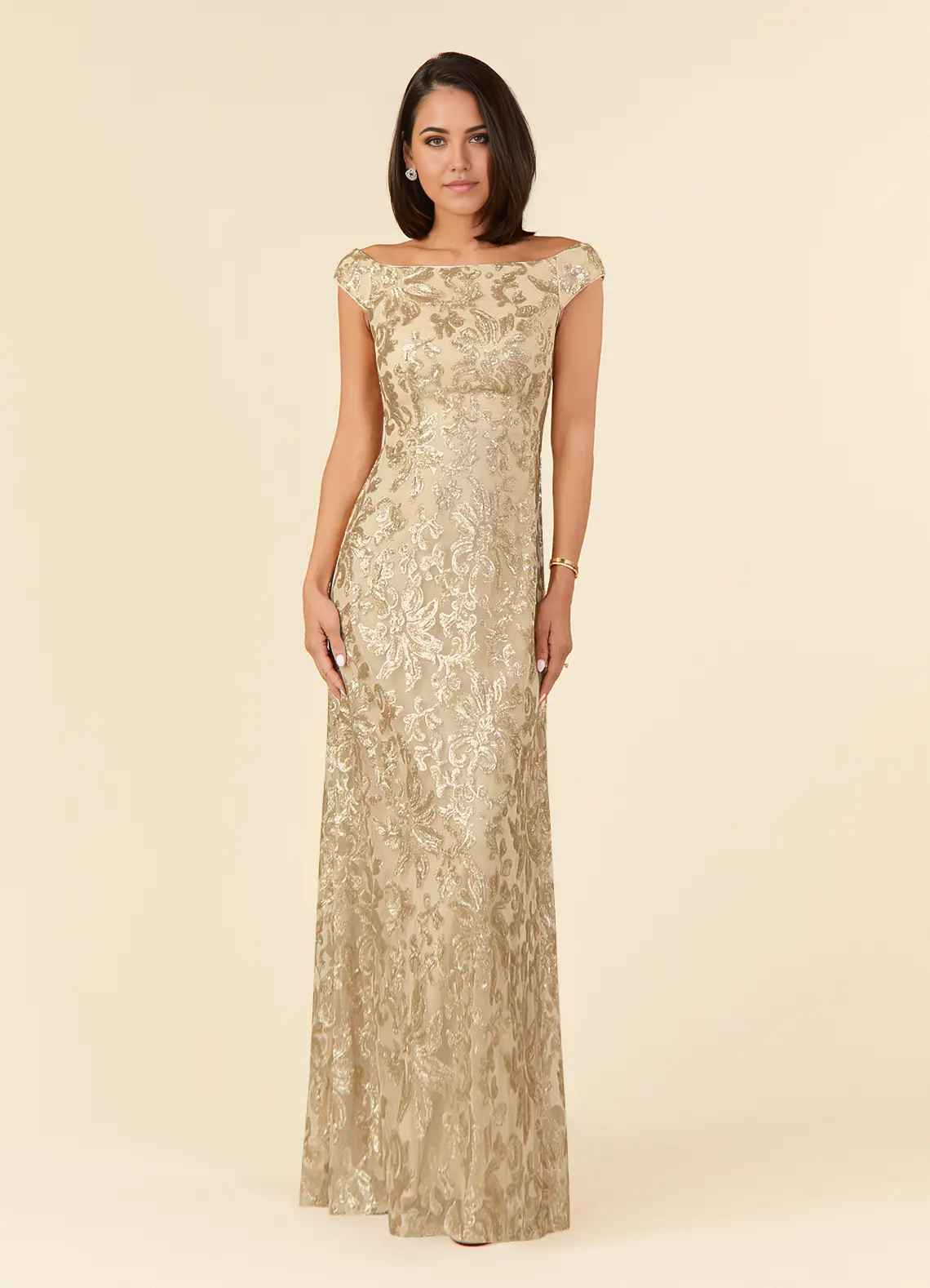 Elegant woman wearing a champagne A-line off-shoulder lace formal dress.
