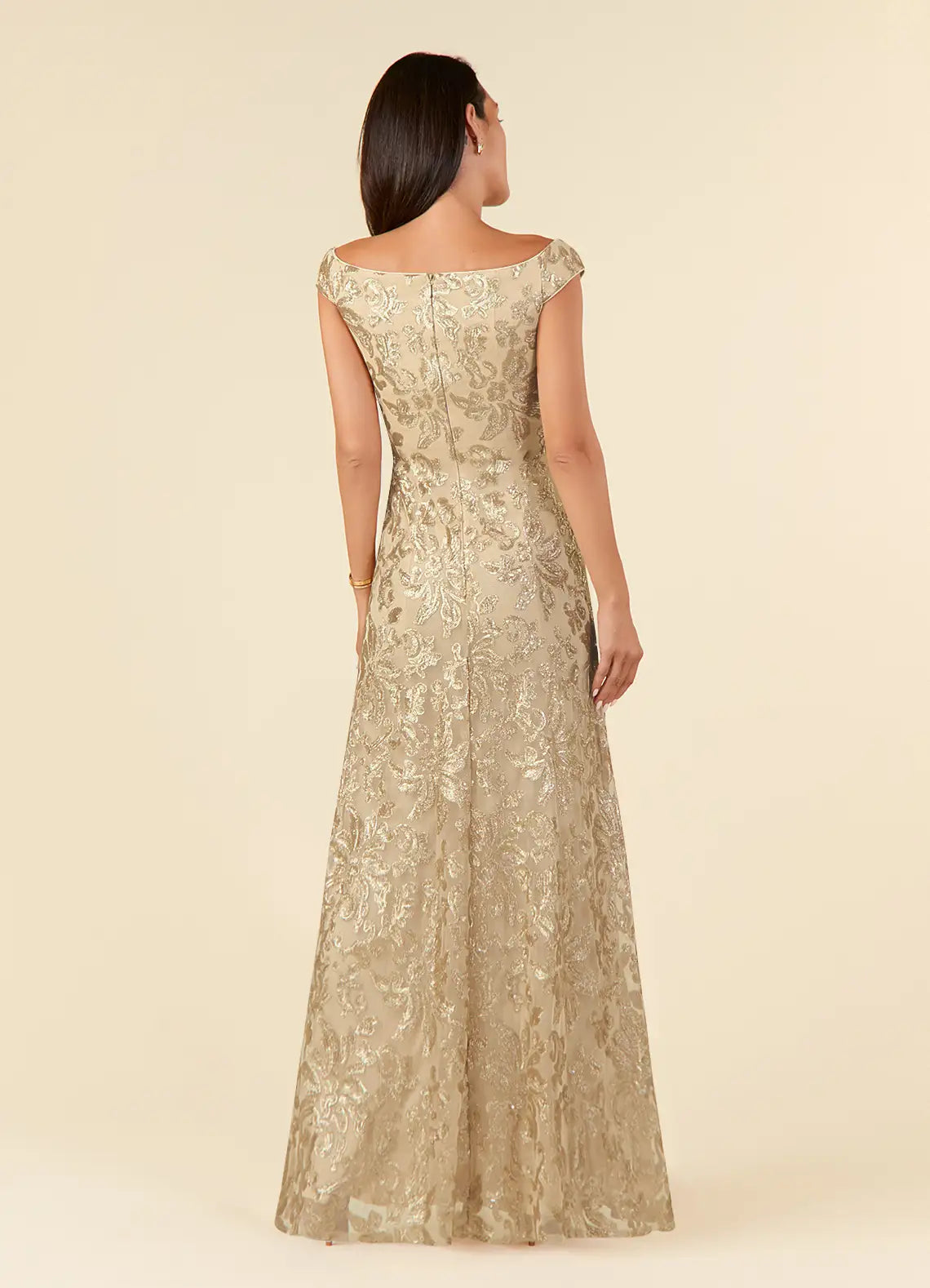 Side view of a champagne A-line off-shoulder lace formal dress.