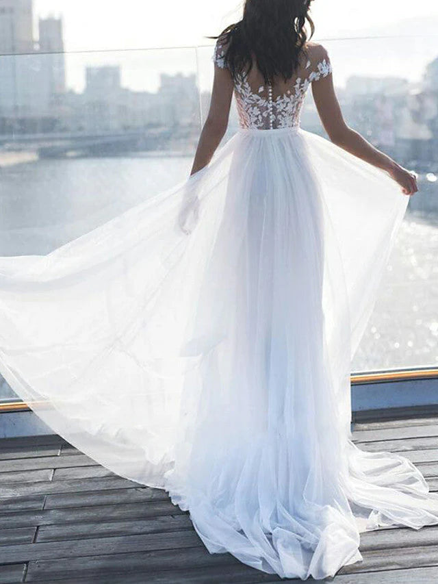 Back view of A-Line off-shoulder lace wedding dress with sleeves.
